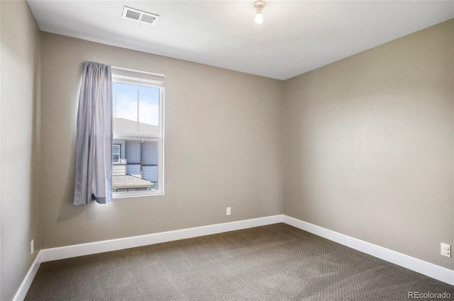 3450 Valentia St, Denver, CO 80238 - spare room with dark colored carpet and baseboards