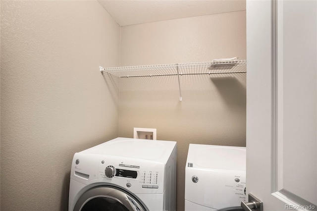 3450 Valentia St, Denver, CO 80238 - laundry area with washing machine and clothes dryer