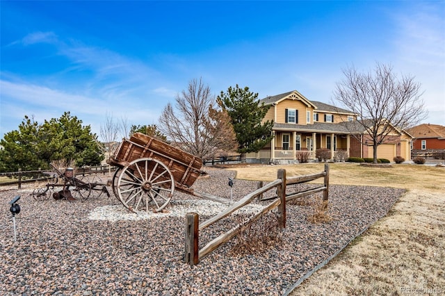 exterior space featuring fence and covered porch