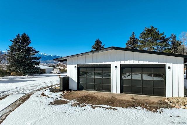 view of snow covered garage