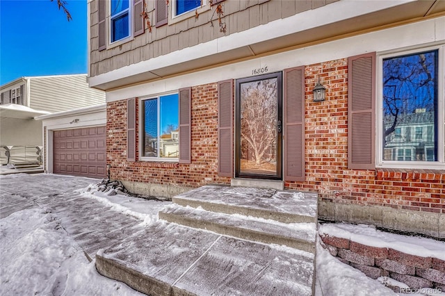 view of snow covered property entrance