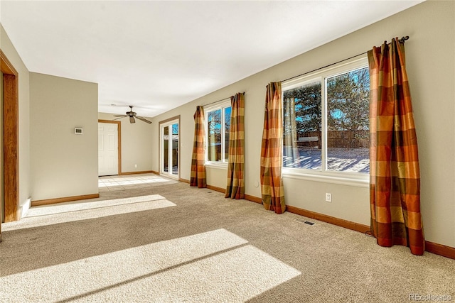 carpeted empty room with ceiling fan