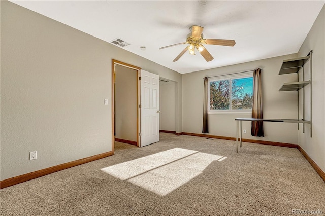 unfurnished bedroom featuring ceiling fan and light colored carpet