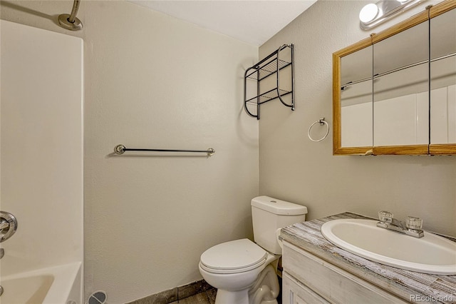 full bathroom with vanity, shower / bath combination, and toilet