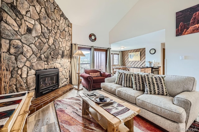 325 Four O Clock Rd Unit 303, Breckenridge, CO 80424 - living room with high vaulted ceiling, wood finished floors, and a fireplace