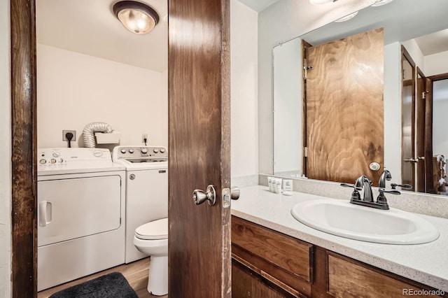 325 Four O Clock Rd Unit 303, Breckenridge, CO 80424 - bathroom featuring vanity, toilet, and washer and dryer