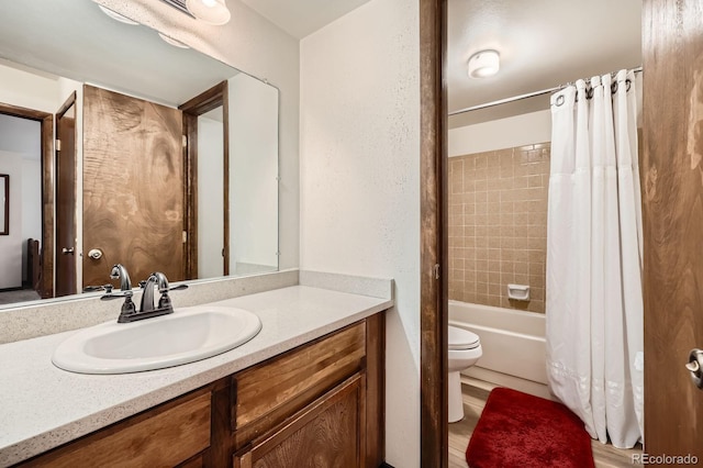 325 Four O Clock Rd Unit 303, Breckenridge, CO 80424 - bathroom featuring toilet, vanity, and shower / bathtub combination with curtain