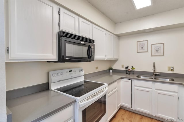 kitchen with white cabinetry, sink, light wood-type flooring, and white electric stove