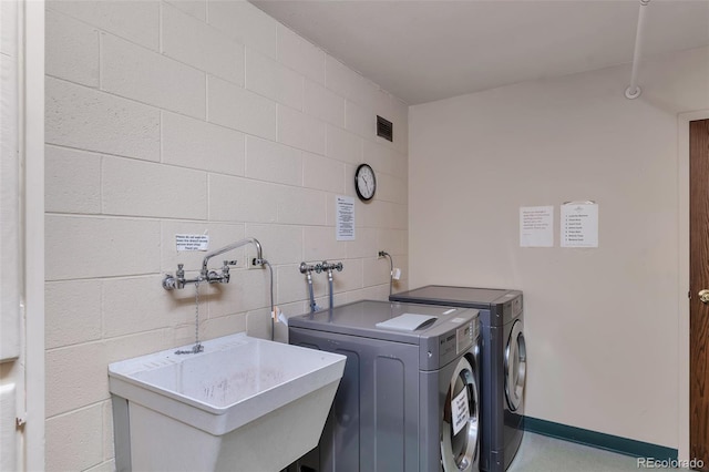 1850 Folsom St Unit 411, Boulder, CO 80302 - laundry room with a sink, washer and clothes dryer, and tile walls