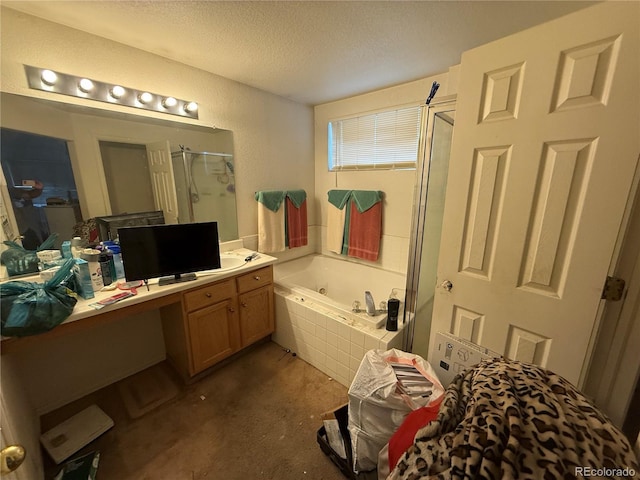 14874 E 52nd Ave, Denver, CO 80239 - bathroom featuring a shower stall, a textured ceiling, vanity, and a tub with jets