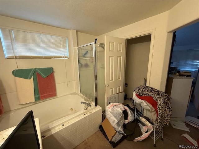 14874 E 52nd Ave, Denver, CO 80239 - bathroom featuring a stall shower, a tub with jets, and a textured ceiling