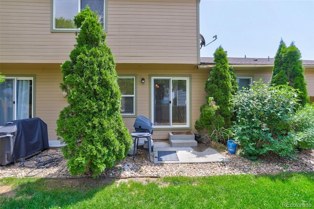 rear view of property featuring a patio