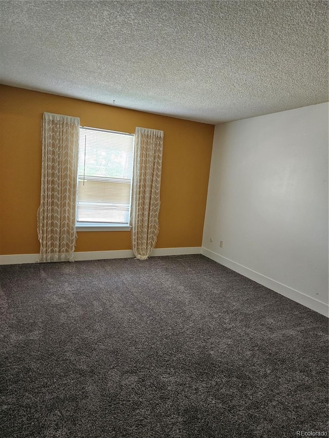 7000 W 20th Ave Unit 106, Lakewood, CO 80214 - empty room with dark colored carpet, a textured ceiling, and baseboards