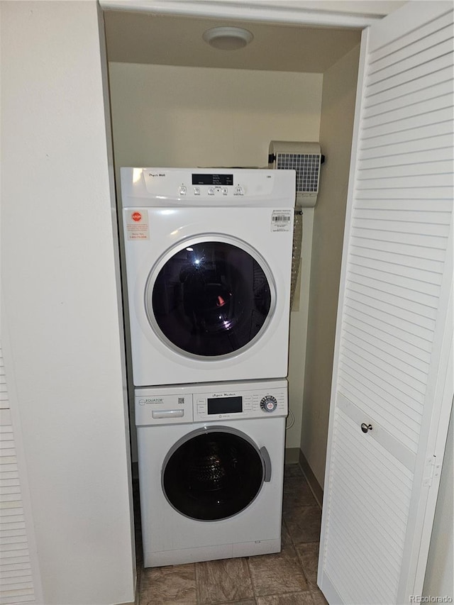 7000 W 20th Ave Unit 106, Lakewood, CO 80214 - washroom featuring estacked washer and dryer