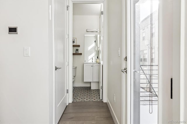 corridor featuring hardwood / wood-style floors