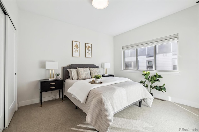 bedroom featuring a closet and carpet flooring