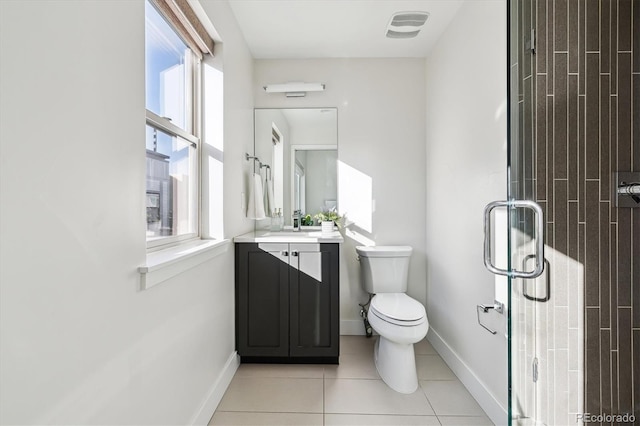 bathroom with tile patterned floors, walk in shower, vanity, and a healthy amount of sunlight