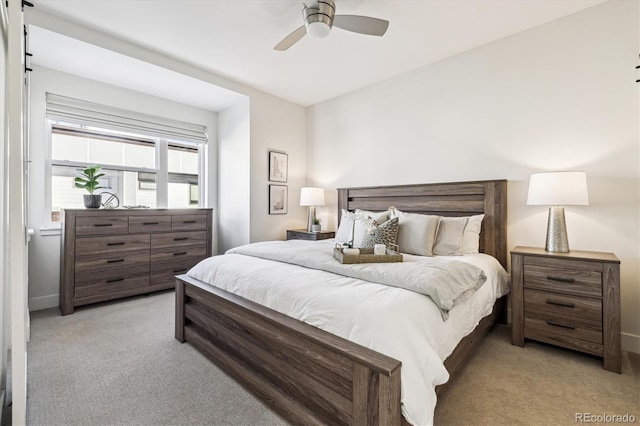 carpeted bedroom with ceiling fan