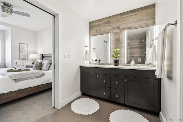 bathroom featuring vanity, ceiling fan, and walk in shower