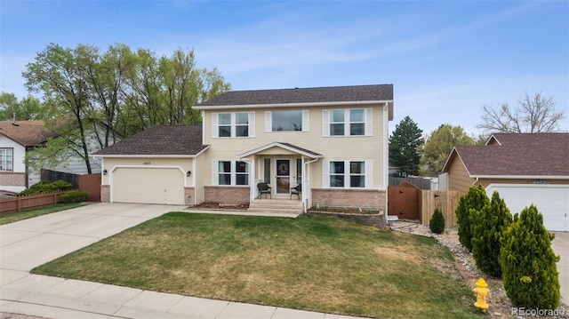 1055 Lindstrom Dr, Colorado Springs, CO 80911 - colonial house featuring brick siding, an attached garage, driveway, and a gate