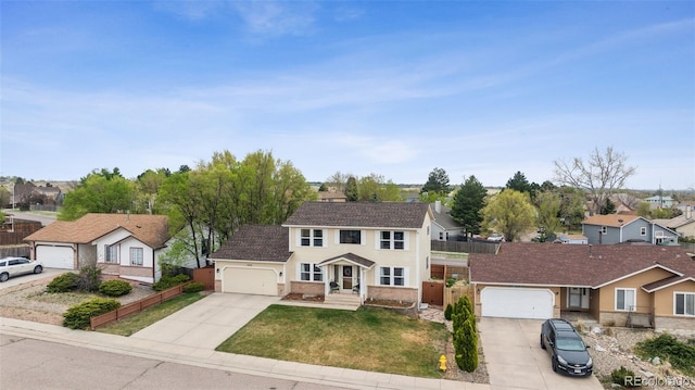 1055 Lindstrom Dr, Colorado Springs, CO 80911 - view of front of property featuring a residential view, concrete driveway, stucco siding, an attached garage, and roof with shingles