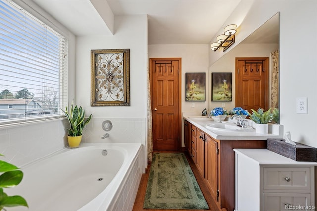 1055 Lindstrom Dr, Colorado Springs, CO 80911 - bathroom with a bath and double vanity