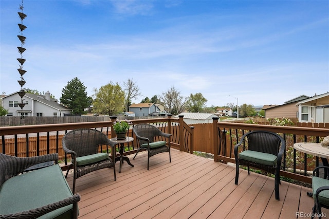 1055 Lindstrom Dr, Colorado Springs, CO 80911 - wooden terrace with a residential view and fence