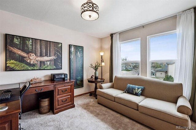1055 Lindstrom Dr, Colorado Springs, CO 80911 - living area with light carpet, a desk, and baseboards