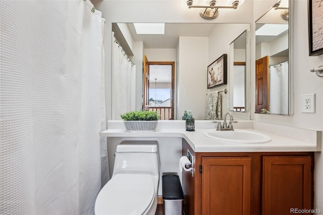 1055 Lindstrom Dr, Colorado Springs, CO 80911 - full bathroom featuring a skylight, vanity, and toilet
