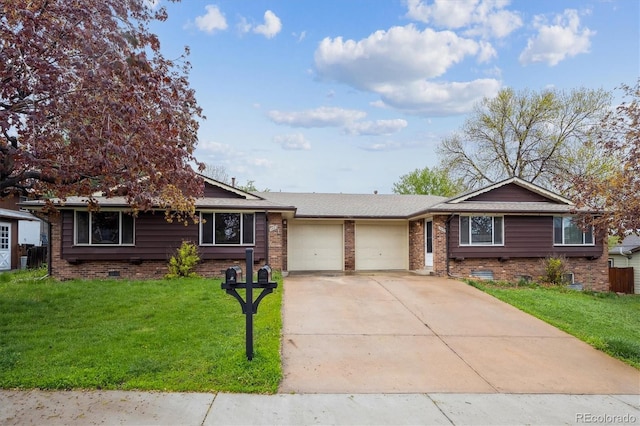 3685 Lewis St, Wheat Ridge, CO 80033 - ranch-style house with a garage, concrete driveway, a front yard, and brick siding