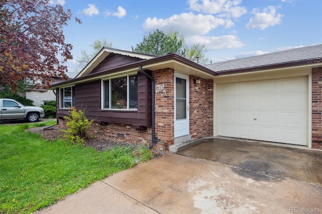 3685 Lewis St, Wheat Ridge, CO 80033 - ranch-style house featuring an attached garage, driveway, brick siding, and a front lawn