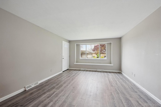 3685 Lewis St, Wheat Ridge, CO 80033 - empty room featuring wood finished floors and baseboards
