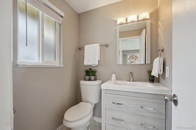 3685 Lewis St, Wheat Ridge, CO 80033 - half bath with plenty of natural light, toilet, and vanity
