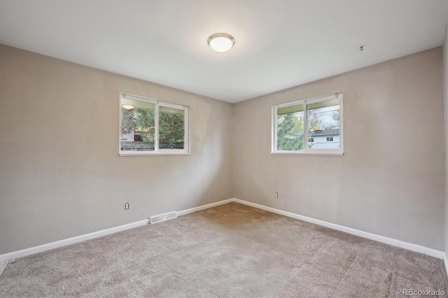 3685 Lewis St, Wheat Ridge, CO 80033 - empty room with plenty of natural light, baseboards, and carpet floors
