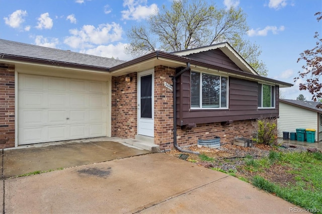3685 Lewis St, Wheat Ridge, CO 80033 - ranch-style home with concrete driveway, an attached garage, and brick siding