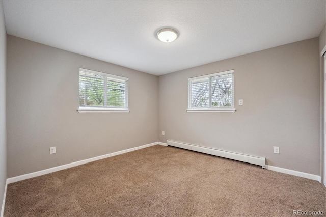 3685 Lewis St, Wheat Ridge, CO 80033 - unfurnished room featuring a baseboard radiator, carpet flooring, and baseboards