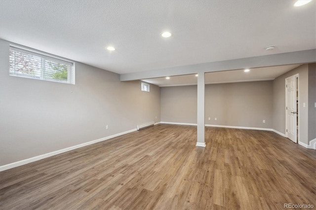 3685 Lewis St, Wheat Ridge, CO 80033 - basement featuring baseboards, wood finished floors, and recessed lighting