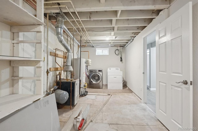 3685 Lewis St, Wheat Ridge, CO 80033 - laundry area with washing machine and dryer, gas water heater, and a heating unit