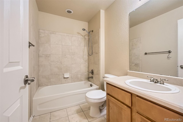 full bathroom with tile patterned floors, vanity, toilet, and tiled shower / bath