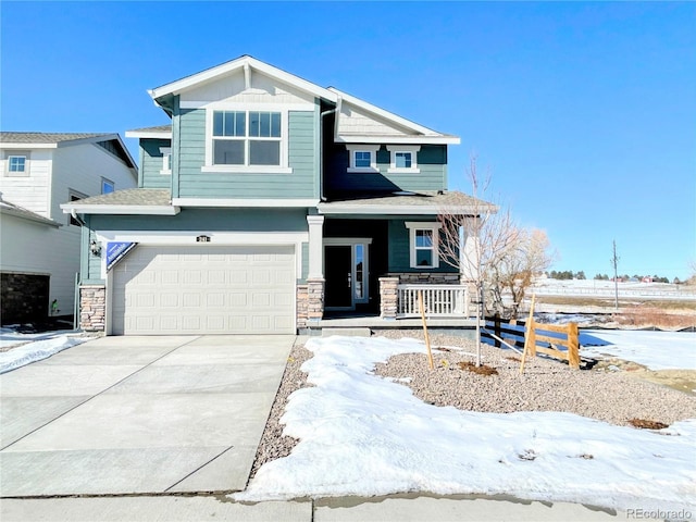 view of front of house featuring a garage and a porch