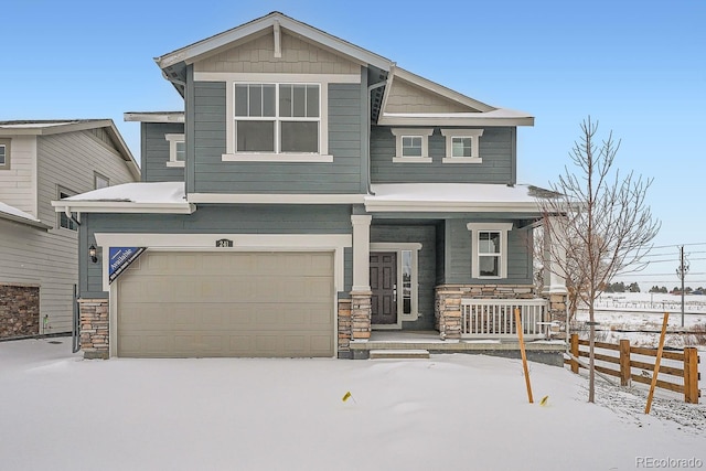 view of front facade with a garage and covered porch