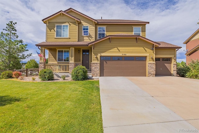 craftsman-style home with a front lawn, covered porch, and a garage