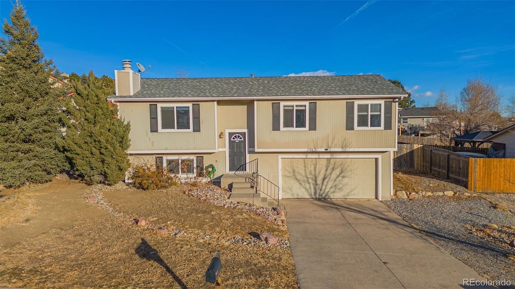 raised ranch featuring a garage