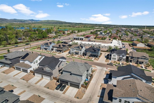 aerial view of residential area with a water and mountain view