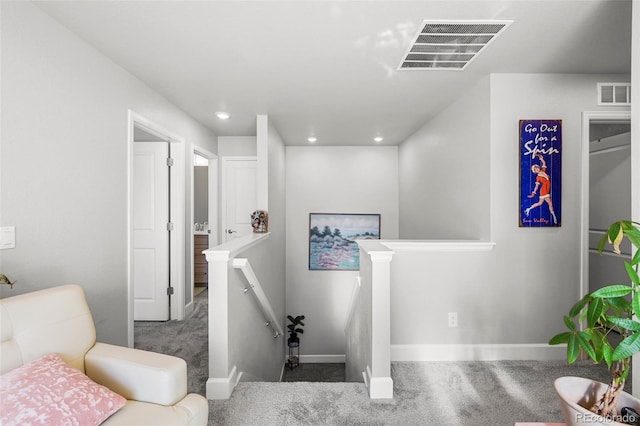 stairway featuring carpet, baseboards, and recessed lighting