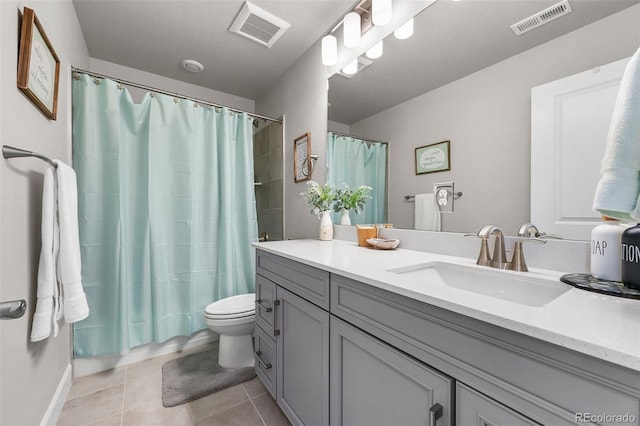 full bathroom featuring tile patterned flooring, toilet, vanity, a shower with curtain, and baseboards