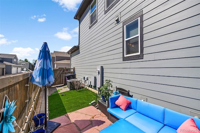 view of patio / terrace with an outdoor living space and a fenced backyard