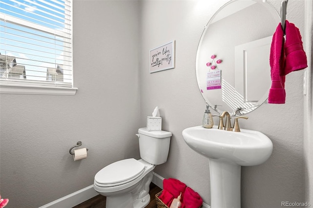 4581 S Kipling Cir, Denver, CO 80123 - bathroom featuring baseboards, toilet, and wood finished floors