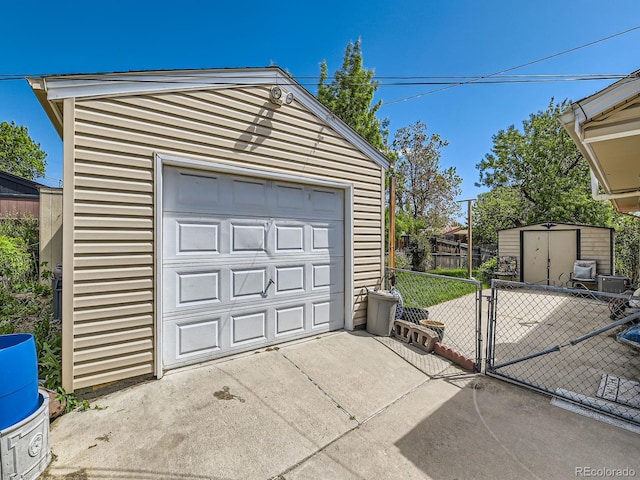 3531 E 91st Ave, Thornton, CO 80229 - detached garage featuring concrete driveway and a gate