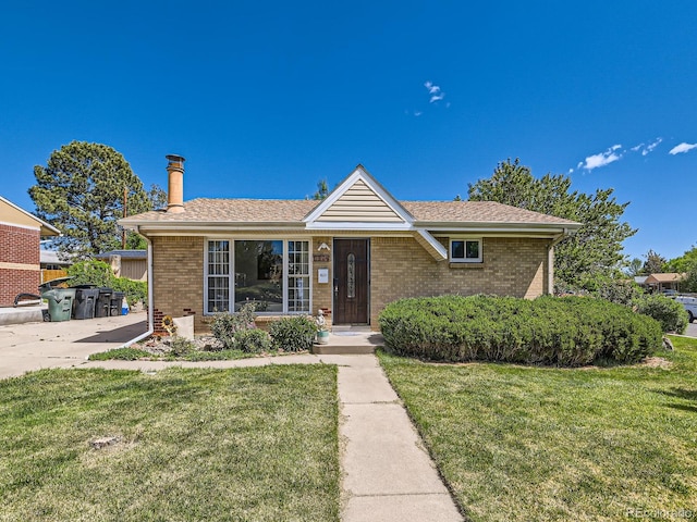 3531 E 91st Ave, Thornton, CO 80229 - single story home featuring brick siding, a front yard, and a shingled roof